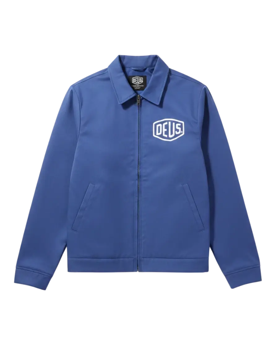 Veste de travail bleue Surfshop - Shapers Club House DEUS avec fermeture éclair et logo blanc sur la poitrine