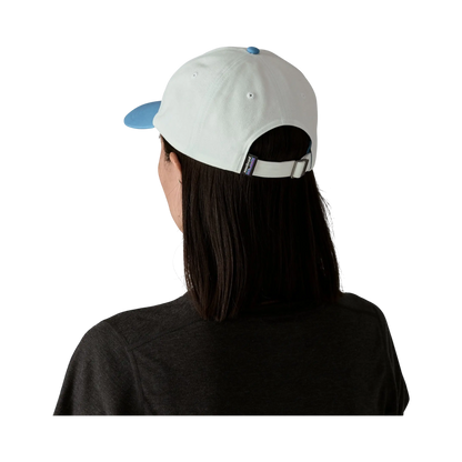 Rear view of the Patagonia P-6 Label Trad Cap blue cap worn by a woman, Surfshop - Shapers Club House