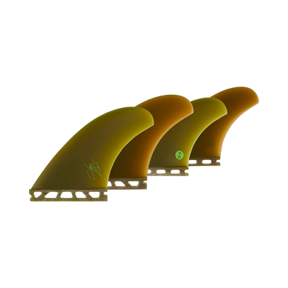 Shapers-Club- fins Three McCallum Raked QD surfboards (Single Tab) are presented side by side in graduated shades of brown and green. Each of them features a visible logo at the base, highlighting precise craftsmanship. The solid, unified base accentuates their unique patterns. -surfshop-surfboard