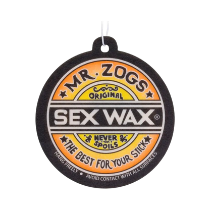 Shapers-Club - A round deodorant "Sex - Wax Airfreshner" in black, white and orange colors designed to resemble a surfboard wax label "Mr. Zogs Sex". Wax It reads: "Mr. Zogs - Original - Deodorant Sex - Wax Never ruin it - The best for your board. -surfshop-surfboard
